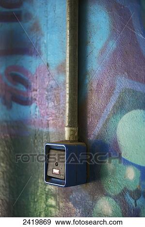 A card reader along a wall painted with a colourful mural; Hamburg, Germany View Large Photo Image Stock Photo - A card reader along a wall painted with a colourful mural; Hamburg, Germany. Fotosearch