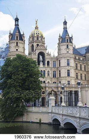Stock Photograph - A Castle Along The Water; Schwerin, Mecklenburg, Germany. Fotosearch
