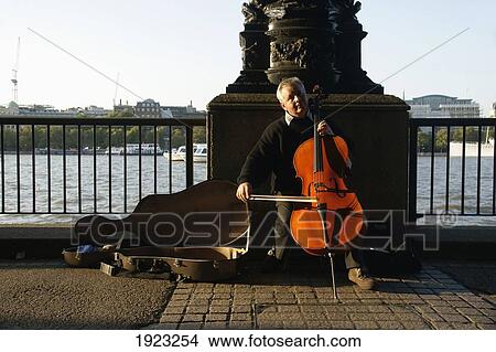 Picture - A Cellist Busts At Southbank; London, United Kingdom. Fotosearch
