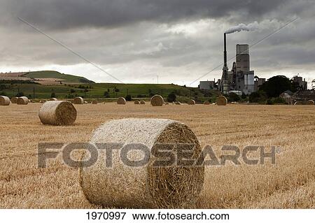 A Cement Production Plant With Hay Bales In A Field In The Foreground; Lothian Scotland View Large Photo Image Stock Photo - A Cement Production Plant With Hay Bales In A Field In The Foreground; Lothian Scotland. Fotosearch