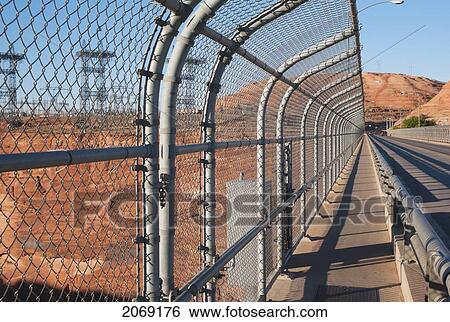 A Chain-Link Fence Running Along The Road At Glen Canyon Dam; Arizona United States Of America View Large Photo Image Stock Photograph - A Chain-Link Fence Running Along The Road At Glen Canyon Dam; Arizona United States Of America. Fotosearch