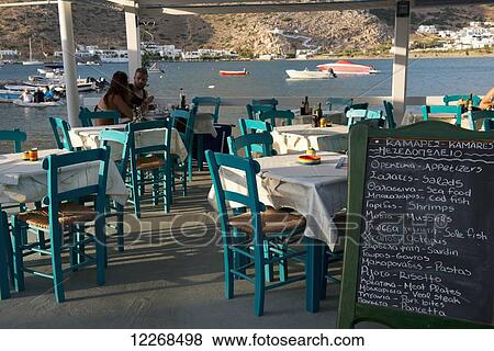 Stock Photo - A chalkboard menu at a taverna; Kamares, Sifnos, Cyclades, Greek Islands, Greece. Fotosearch
