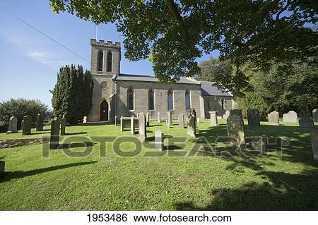 Stock Photograph - A Church And Cemetery; Northumberland England. Fotosearch