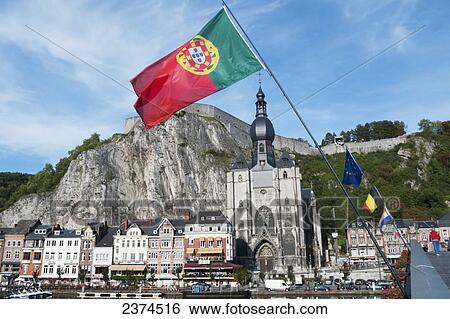 A church and other buildings along the water and flags flying; Dinant, Belgium View Large Photo Image Stock Photograph - A church and other buildings along the water and flags flying; Dinant, Belgium. Fotosearch