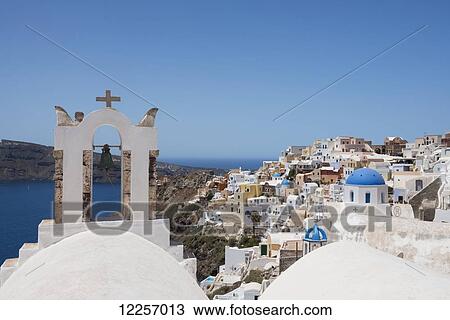 A church bell tower and traditional painted houses overlooking the caldera; Oia, Santorini, Cyclades, Greek Islands, Greece View Large Photo Image Stock Image - A church bell tower and traditional painted houses overlooking the caldera; Oia, Santorini, Cyclades, Greek Islands, Greece. Fotosearch