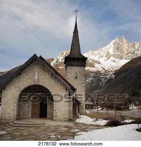 A Church With A Steeple And Mountains In The Background; Chamonix-Mont-Blanc Rhone-Alpes France View Large Photo Image Stock Image - A Church With A Steeple And Mountains In The Background; Chamonix-Mont-Blanc Rhone-Alpes France. Fotosearch