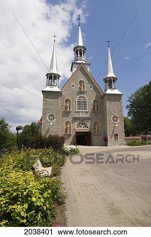 Stock Image - A Church With White Bell Towers; Ile D'orleans Quebec Canada. Fotosearch