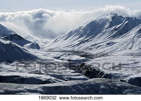 Stock Image - A Clearing Storm Leaves Fresh Snow On The Foothills Of The Alaska Range; Denali National Park And Preserve, Alaska, Usa. Fotosearch