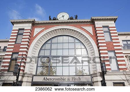 A clock and brick facade of a retail building with an arched window; California, United States of America View Large Photo Image Stock Image - A clock and brick facade of a retail building with an arched window; California, United States of America. Fotosearch