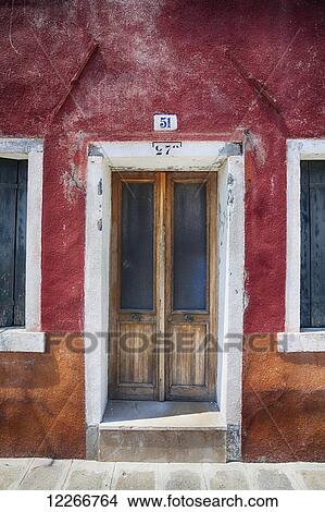 A close view of a door on a rustic red house; Burano, Venice, Italy View Large Photo Image Picture - A close view of a door on a rustic red house; Burano, Venice, Italy. Fotosearch