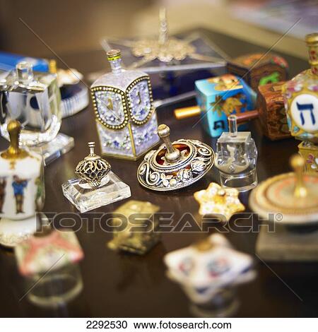 Stock Image - A collection of dreidels on a wood surface; Victoria vancouver island british columbia canada. Fotosearch
