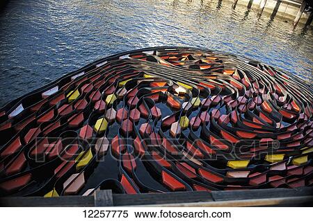 Stock Photography - A colorful coiled oil boom at the Seattle waterfront piers, Washington, USA. Fotosearch