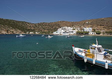 A colourful wooden fishing boat in the harbour in Faros in Southeastern Sifnos; Faros, Sifnos, Cyclades, Greek Islands, Greece View Large Photo Image Picture - A colourful wooden fishing boat in the harbour in Faros in Southeastern Sifnos; Faros, Sifnos, Cyclades, Greek Islands, Greece. Fotosearch
