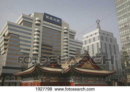 Stock Photo - A Contrast Of Old And New: A Traditional Chinese Structure Beside Modern Skyscrapers, Beijing, China. Fotosearch