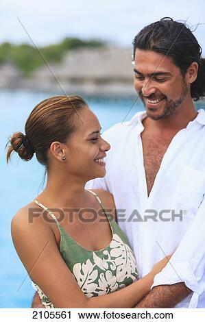 A Couple At The Bora Bora Nui Resort & Spa; Bora Bora Island Society Islands French Polynesia South Pacific View Large Photo Image Stock Image - A Couple At The Bora Bora Nui Resort & Spa; Bora Bora Island Society Islands French Polynesia South Pacific. Fotosearch