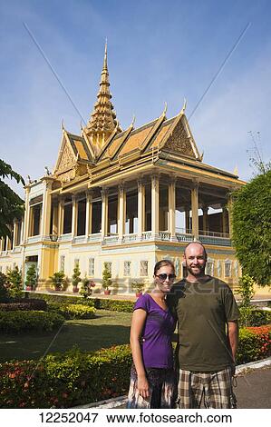 A couple poses in front of the Royal Palace; Phnom Penh, Cambodia View Large Photo Image Stock Photo - A couple poses in front of the Royal Palace; Phnom Penh, Cambodia. Fotosearch