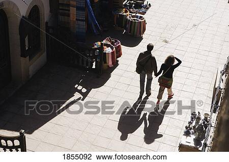 A Couple Walking In The Streets Of Essaouira, Morocco View Large Photo Image Stock Image - A Couple Walking In The Streets Of Essaouira, Morocco. Fotosearch