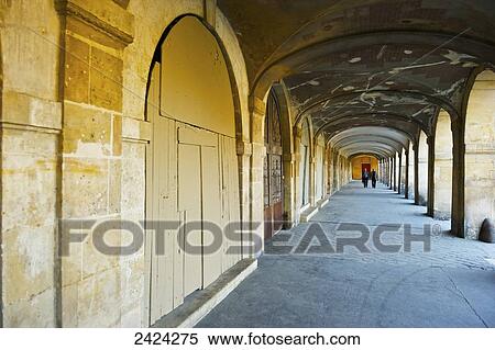 A covered walkway attached to a building, Marais district; Paris, France View Large Photo Image Stock Photography - A covered walkway attached to a building, Marais district; Paris, France. Fotosearch