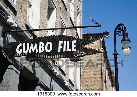 A Crocodile Shaped Sign For Gumbofile, A Cafe Bar, In The French Quarter, New Orleans, Louisiana, Usa View Large Photo Image Stock Photo - A Crocodile Shaped Sign For Gumbofile, A Cafe Bar, In The French Quarter, New Orleans, Louisiana, Usa. Fotosearch
