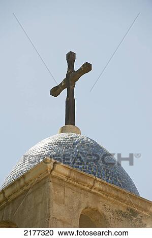 Stock Image - A Cross On Top Of A Dome Roof; Sedona Arizona United States Of America. Fotosearch