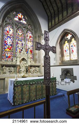 Stock Image - A Cross Table And Stained Glass Windows In St. Mary's Church; Kelso Scottish Borders Scotland. Fotosearch
