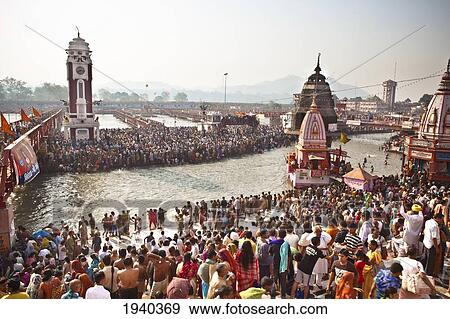 A Crowd Gathers At The Ganges River For The Kumbh Mela Pilgrimage; Haridwar India View Large Photo Image Stock Photo - A Crowd Gathers At The Ganges River For The Kumbh Mela Pilgrimage; Haridwar India. Fotosearch
