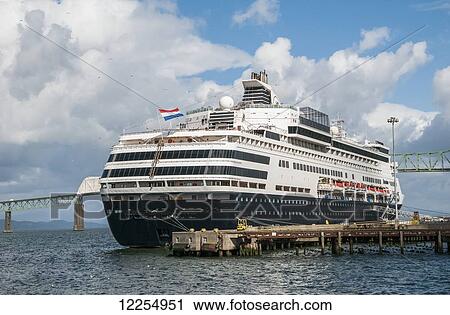 Stock Image - A cruise ship docks in a port; Astoria, Oregon, United States of America. Fotosearch