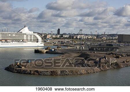 Stock Photo - A Cruise Ship In The Port With Construction Of A New Terminal; Helsinki, Finland. Fotosearch