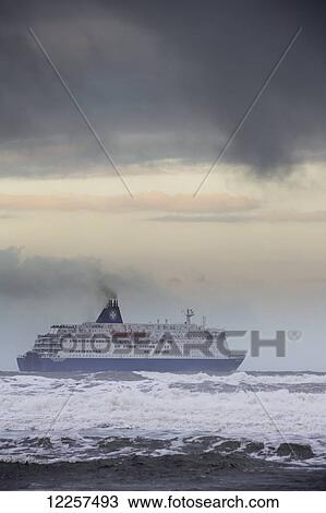 Stock Image - A cruise ship on stormy waters; South Shields, Tyne and Wear, England. Fotosearch
