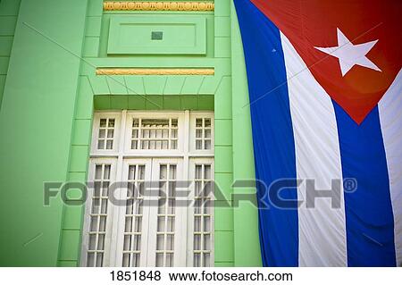Stock Photo - A Cuban Flag Hanging On A Wall Outdoors; Havana, Cuba. Fotosearch