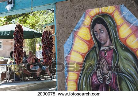 A Depiction Of The Virgin Of Guadalupe Adorns The Walls Of A Restaurant And Gallery, New Mexico, Usa View Large Photo Image Stock Photo - A Depiction Of The Virgin Of Guadalupe Adorns The Walls Of A Restaurant And Gallery, New Mexico, Usa. Fotosearch