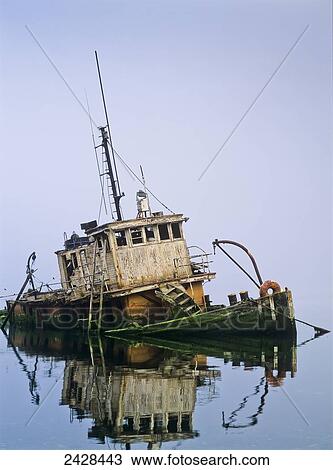 A derelict boat decays at Gold Beach; Oregon, United States of America View Large Photo Image Stock Image - A derelict boat decays at Gold Beach; Oregon, United States of America. Fotosearch