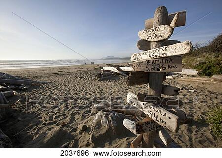 A Destination Distance Sign On Wickaninnish Beach In Pacific Rim National Park Near Tofino; British Columbia Canada View Large Photo Image Stock Photograph - A Destination Distance Sign On Wickaninnish Beach In Pacific Rim National Park Near Tofino; British Columbia Canada. Fotosearch