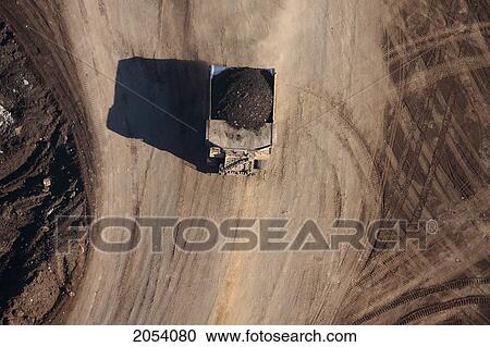 A Dump Truck Carries A 400 Ton Load Of Oil Sands Ore, Mining Operation, Fort Mcmurray, Alberta View Large Photo Image Stock Image - A Dump Truck Carries A 400 Ton Load Of Oil Sands Ore, Mining Operation, Fort Mcmurray, Alberta. Fotosearch