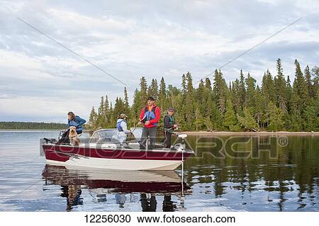 A family fishing from their motorboat on a calm lake in Northern Ontario; Ontario, Canada View Large Photo Image Stock Image - A family fishing from their motorboat on a calm lake in Northern Ontario; Ontario, Canada. Fotosearch