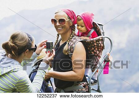A family overlooks the breathtaking views over Waimea Canyon; Kauai, Hawaii, United States of America View Large Photo Image Stock Photo - A family overlooks the breathtaking views over Waimea Canyon; Kauai, Hawaii, United States of America. Fotosearch