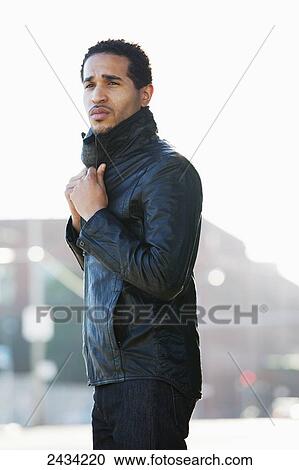 A fashionable man standing on the street in a black leather jacket; San Francisco, California, USA View Large Photo Image Stock Image - A fashionable man standing on the street in a black leather jacket; San Francisco, California, USA. Fotosearch