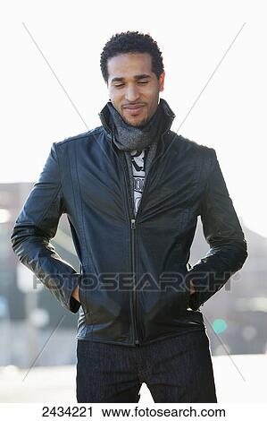 A fashionable man standing on the street in a black leather jacket; San Francisco, California, USA View Large Photo Image Stock Image - A fashionable man standing on the street in a black leather jacket; San Francisco, California, USA. Fotosearch