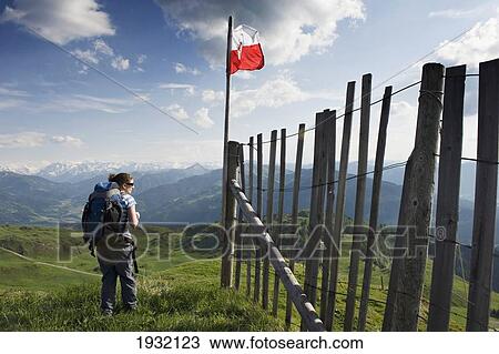 A female hiker enjoys the panoramic view from the Kitzbuheler Horn. Kitzbuehel. Tyrol. Austria. View Large Photo Image Stock Image - A female hiker enjoys the panoramic view from the Kitzbuheler Horn. Kitzbuehel. Tyrol. Austria.. Fotosearch