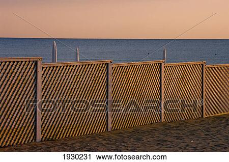 A fence on the beach at the water's edge; Paestum, Campania, Italy View Large Photo Image Stock Image - A fence on the beach at the water's edge; Paestum, Campania, Italy. Fotosearch