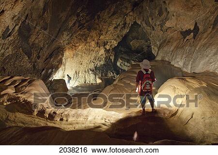 A Filipino Tour Guide Holds A Lantern Inside Sumaging Cave Or Big Cave Near Sagada; Luzon Philippines View Large Photo Image Stock Photograph - A Filipino Tour Guide Holds A Lantern Inside Sumaging Cave Or Big Cave Near Sagada; Luzon Philippines. Fotosearch