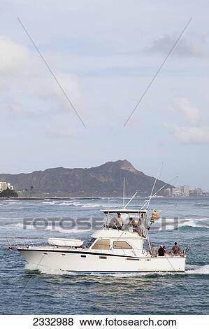 A fishing boat comes back to the Honolulu Yacht Harbor, with Diamond Head in the background; Honolulu, Oahu, Hawaii, United States of America View Large Photo Image Stock Photo - A fishing boat comes back to the Honolulu Yacht Harbor, with Diamond Head in the background; Honolulu, Oahu, Hawaii, United States of America. Fotosearch