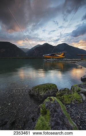 A Float Plane On Muncho Lake At Sunset; British Columbia, Canada View Large Photo Image Stock Image - A Float Plane On Muncho Lake At Sunset; British Columbia, Canada. Fotosearch