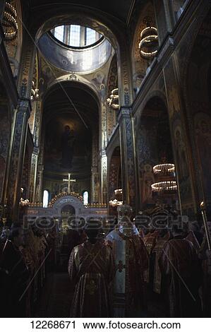A funeral service at St Volodymyr's cathedral, a nineteenth century building with art nouveau murals; Kiev, Ukraine View Large Photo Image Stock Image - A funeral service at St Volodymyr's cathedral, a nineteenth century building with art nouveau murals; Kiev, Ukraine. Fotosearch