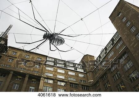 A giant spider at the centre of a web made up of steel cabling at the Biennial, Britain's largest festival of contemporary visual art; Liverpool, England View Large Photo Image Stock Photo - A giant spider at the centre of a web made up of steel cabling at the Biennial, Britain's largest festival of contemporary visual art; Liverpool, England. Fotosearch