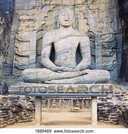 Stock Photo - A Giant Stone Carved Seated Buddha.. Fotosearch