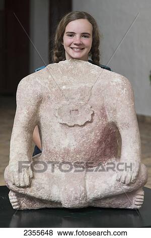 A Girl Stands With Her Head Showing Above A Clay Sculpture Of A Headless Body; Copan, Honduras View Large Photo Image Stock Photo - A Girl Stands With Her Head Showing Above A Clay Sculpture Of A Headless Body; Copan, Honduras. Fotosearch
