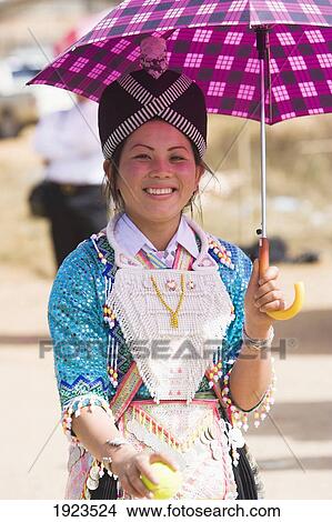 Picture - A Girl Wearing A Traditional Hmong Costume At The New Year Festival, Phonsavan, Laos. Fotosearch