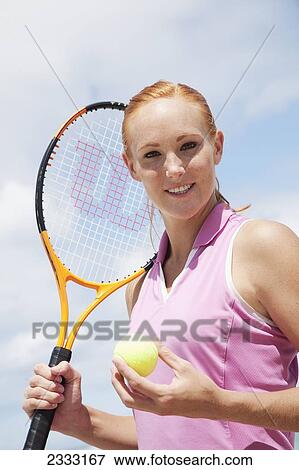 A girl with a tennis ball and racquet; Oahu, Hawaii, United States of America View Large Photo Image Stock Photo - A girl with a tennis ball and racquet; Oahu, Hawaii, United States of America. Fotosearch