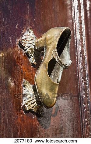 A Gold Shoe Mounted On A Wooden Door As A Door Handle; Chiclana De La Frontera Andalusia Spain View Large Photo Image Stock Image - A Gold Shoe Mounted On A Wooden Door As A Door Handle; Chiclana De La Frontera Andalusia Spain. Fotosearch